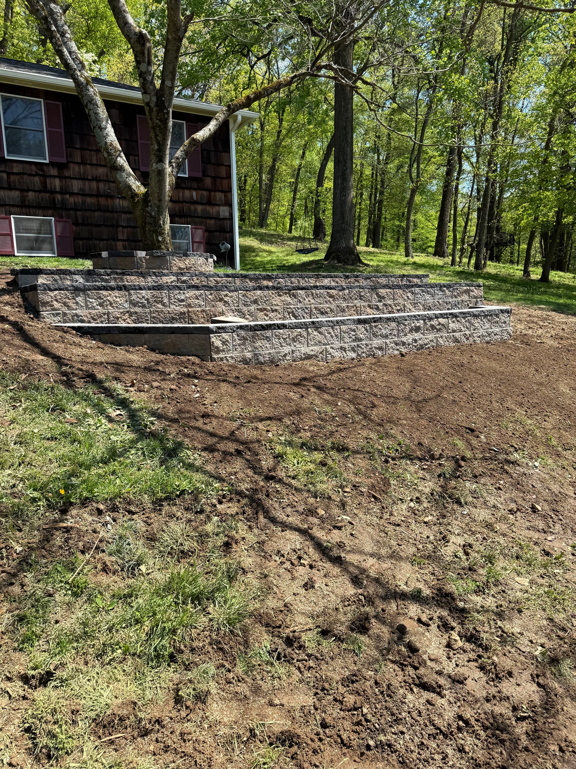 Old Wood Wall Replaced With a 3-Tier Decorative Retaining Wall