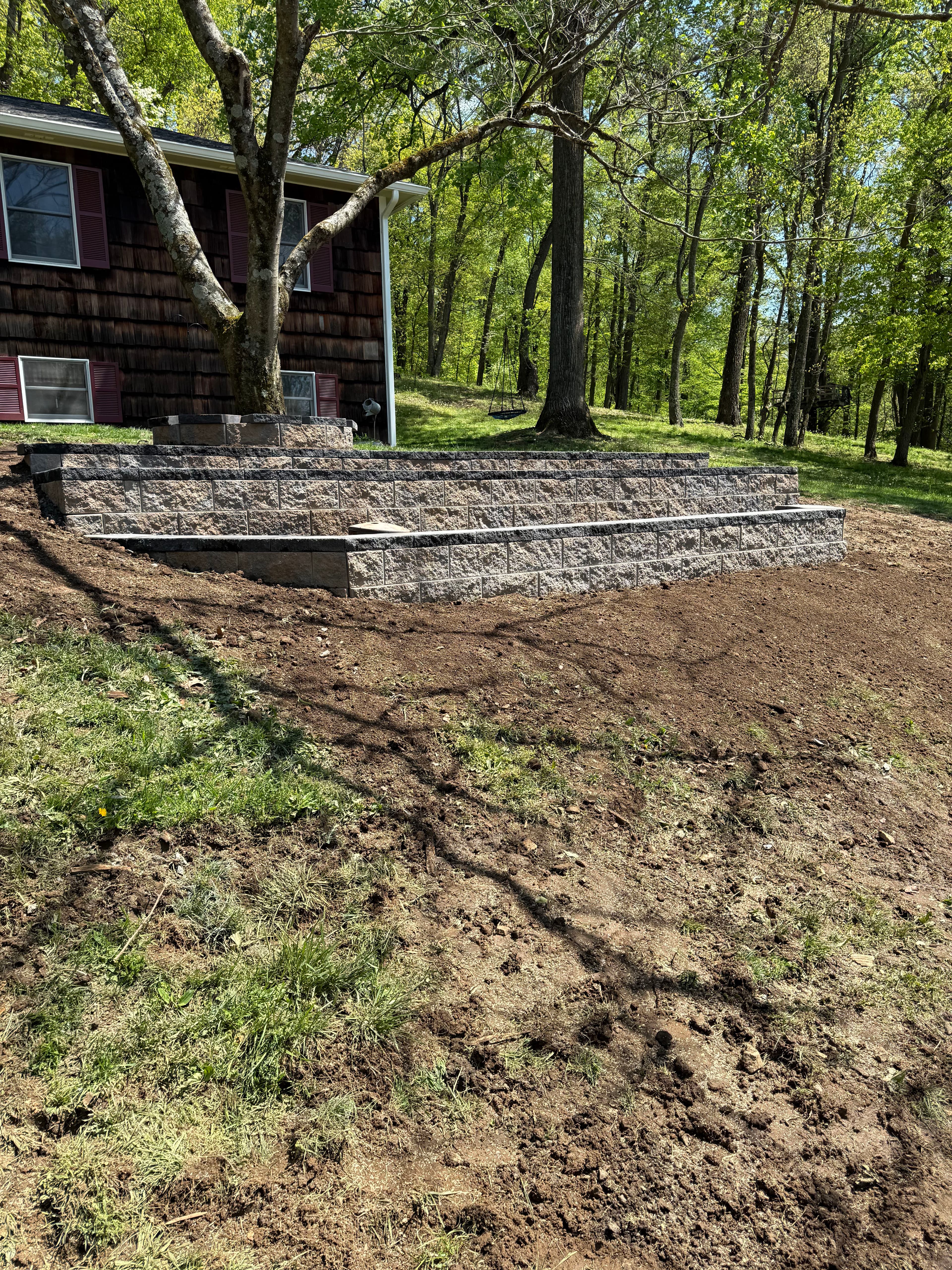 Project Old Wood Wall Replaced With a 3-Tier Decorative Retaining Wall image