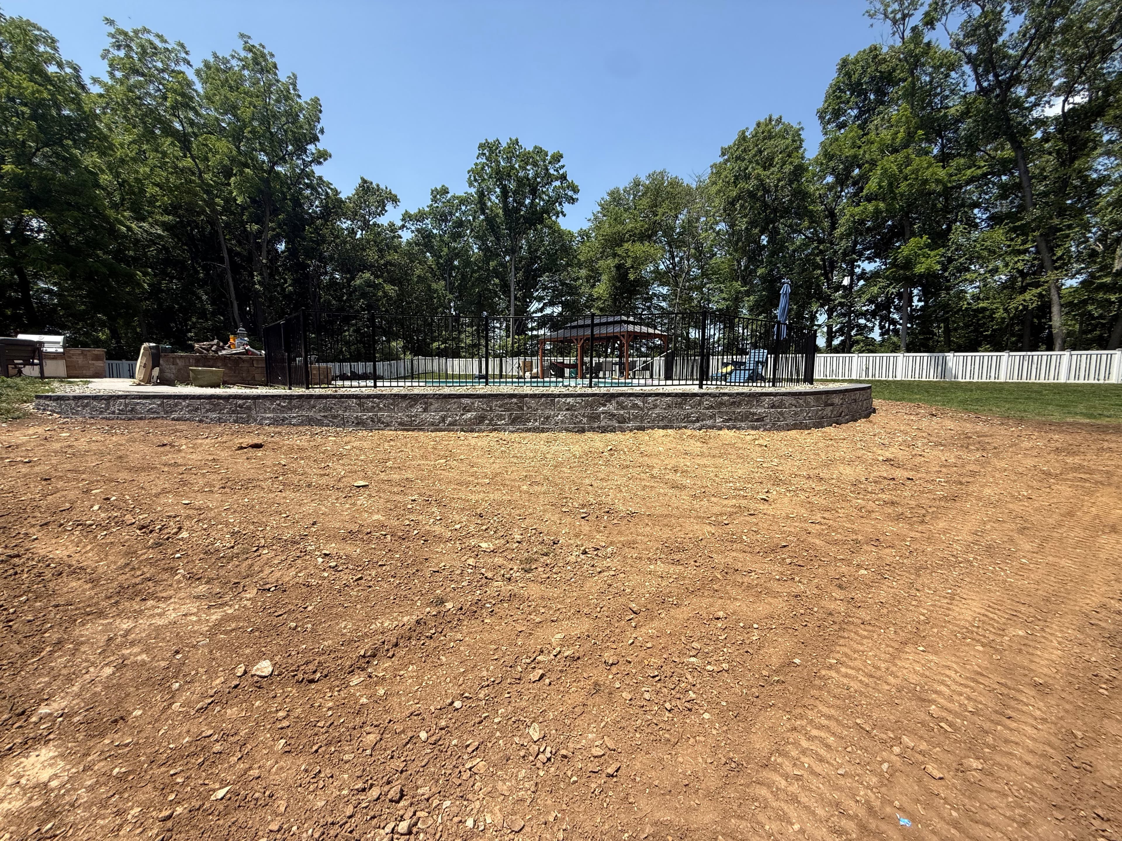 Project 160-Foot Retaining Wall Holds a Poolside Hill in Place image