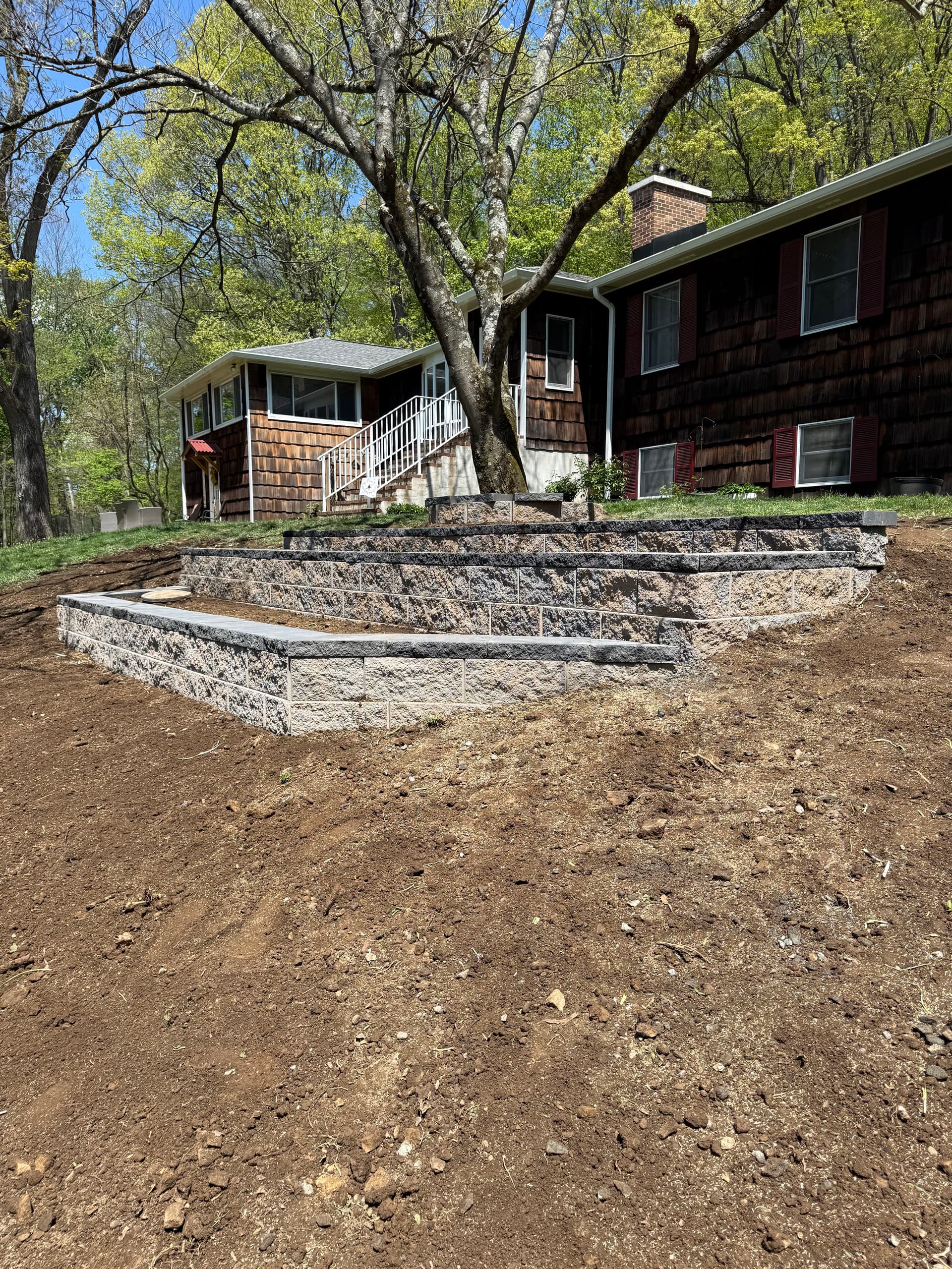 Old Wood Wall Replaced With a 3-Tier Decorative Retaining Wall