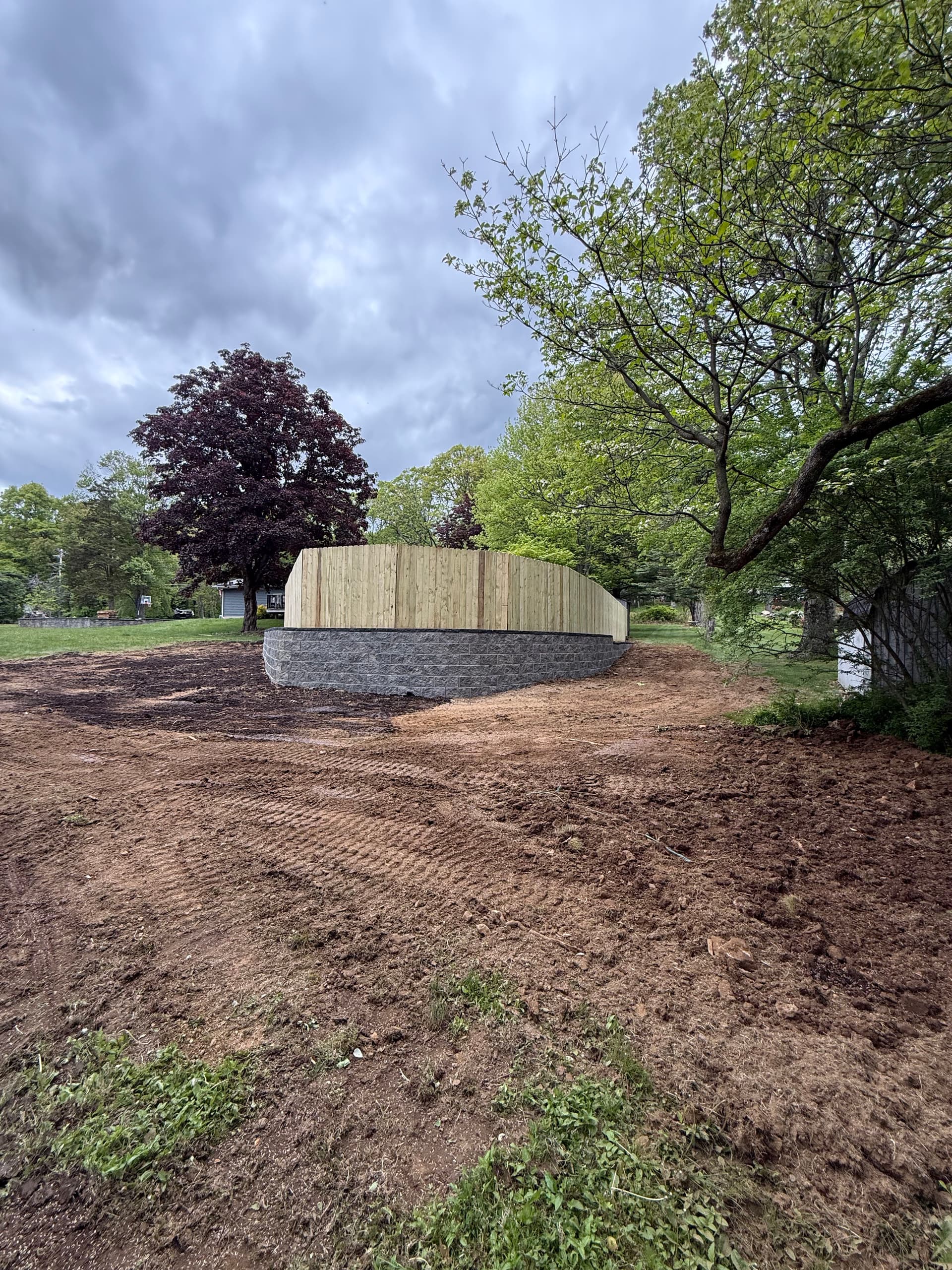 260-Foot Retaining Wall and Fence Replacement for Pool Area