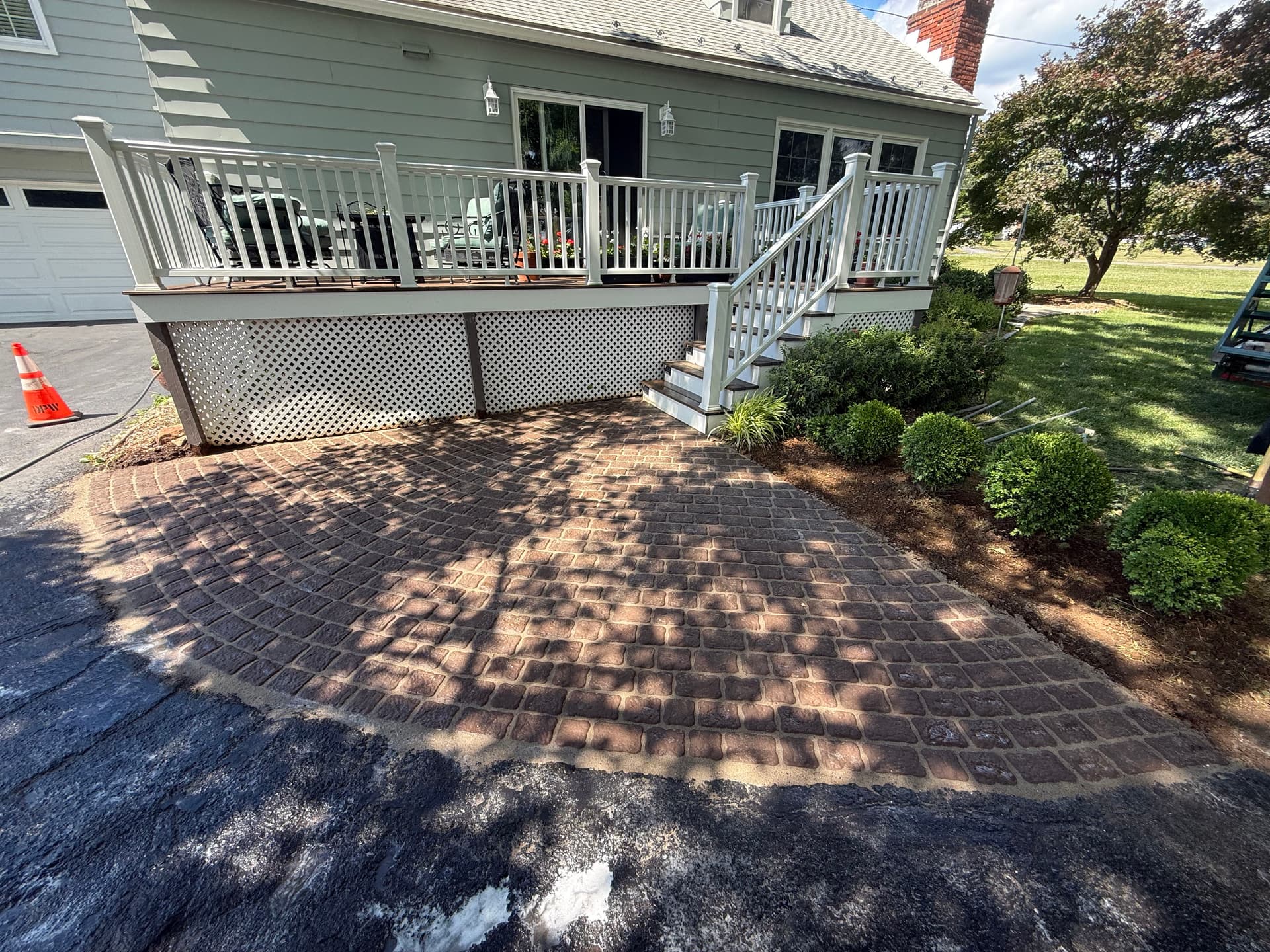 Mocha Belgium Pavers Give This Front Entry a Timeless Look image