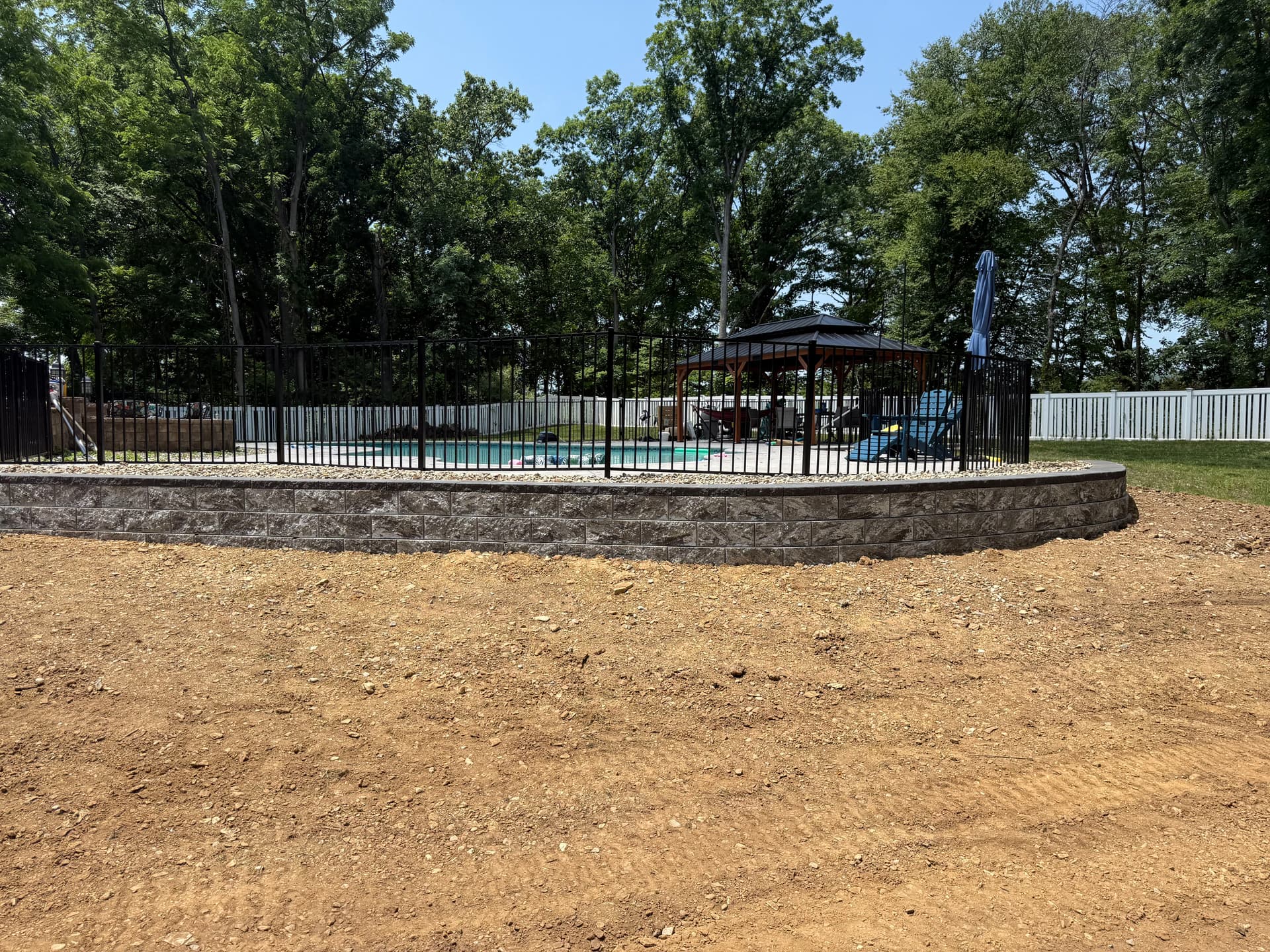 Gallery photos for 160-Foot Retaining Wall Holds a Poolside Hill in Place: Image #1